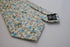skinny cotton ivory cream tie with blue floral design